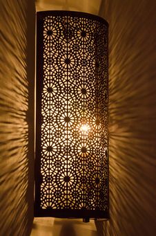 Ornate Metal Lamp Glowing On Marble Wall Royalty Free Stock Image Ornate Metal Lamp Glowing On Marble Wall Royalty Free Stock Image