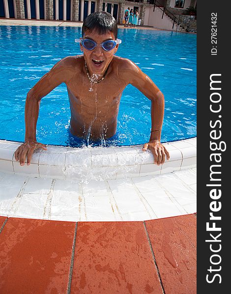 Boy swimmer out of the pool