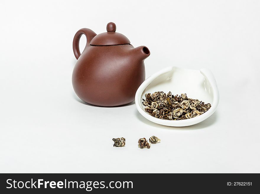 Traditional chinese oolohg tea with a clay teapot on a white background