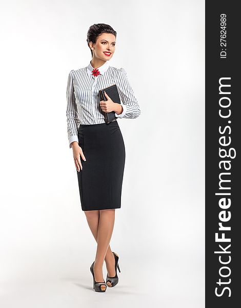Successful smiling fashion woman with notepad
