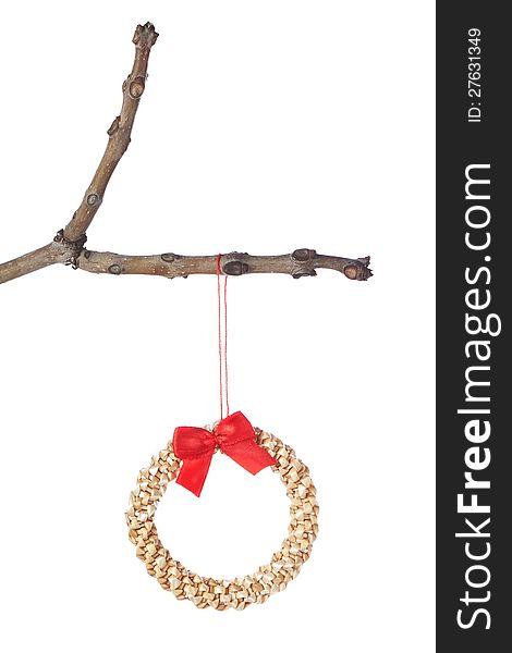 Decorative straw wreath on a branch for Christmas. Isolated. Decorative straw wreath on a branch for Christmas. Isolated.