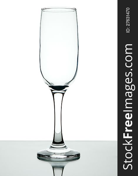 Empty wine glass on a leg on a white background. Empty wine glass on a leg on a white background.