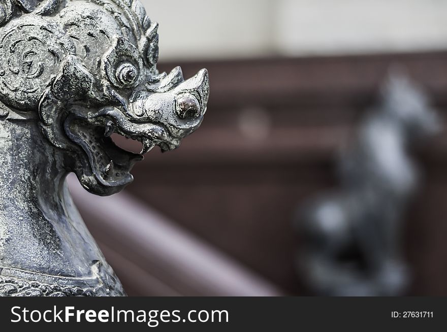 Ancient stone lion technic DOF in thailand .