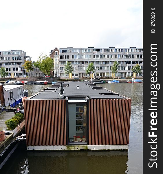 This image presents a floating house in Amsterdam, Holland