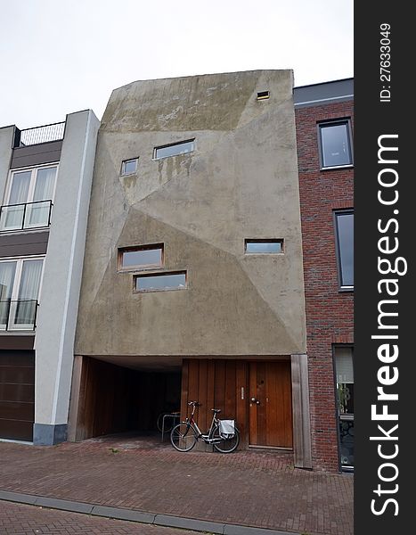 This image presents a modern, yet strange facade of a building from Amsterdam. This image presents a modern, yet strange facade of a building from Amsterdam