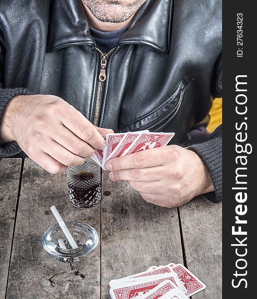 Poker player looking at his hand