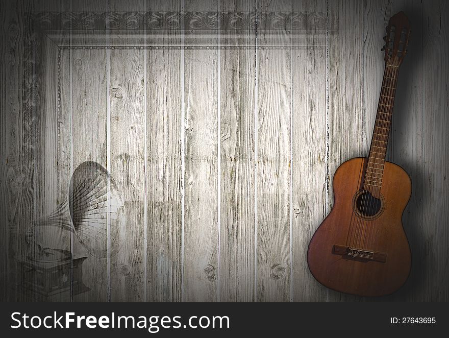 Musical background with a guitar and an old gramophone