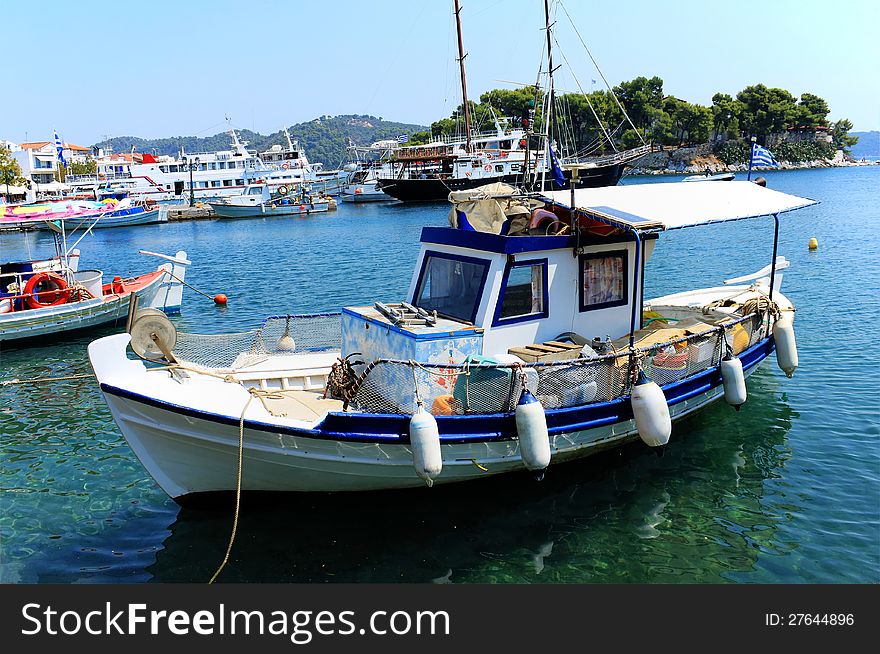 Traditional Greek fishing boat moored in the Skiathos marina, Greece. HDR image.