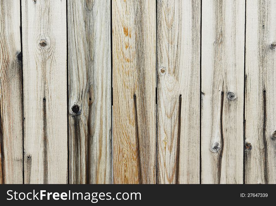 Close up on an old and run-down wooden fence. Close up on an old and run-down wooden fence.