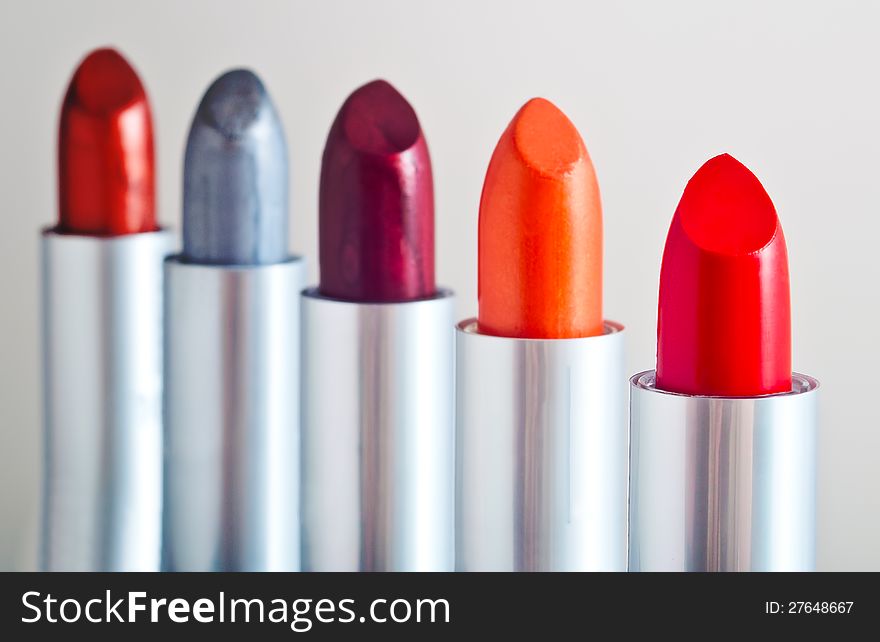 Variety of shades of red lipstick