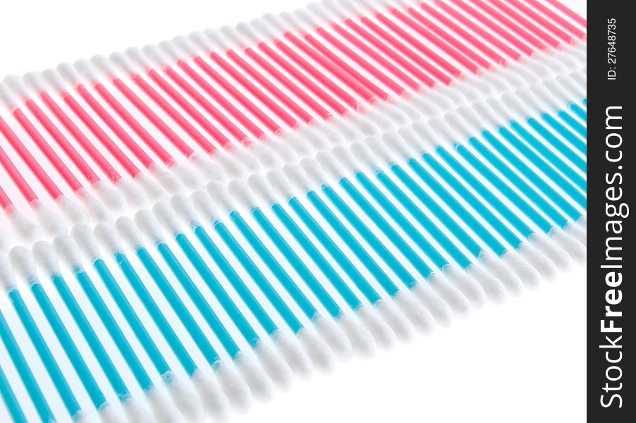 Pink and blue q-tips in rows on white. Pink and blue q-tips in rows on white
