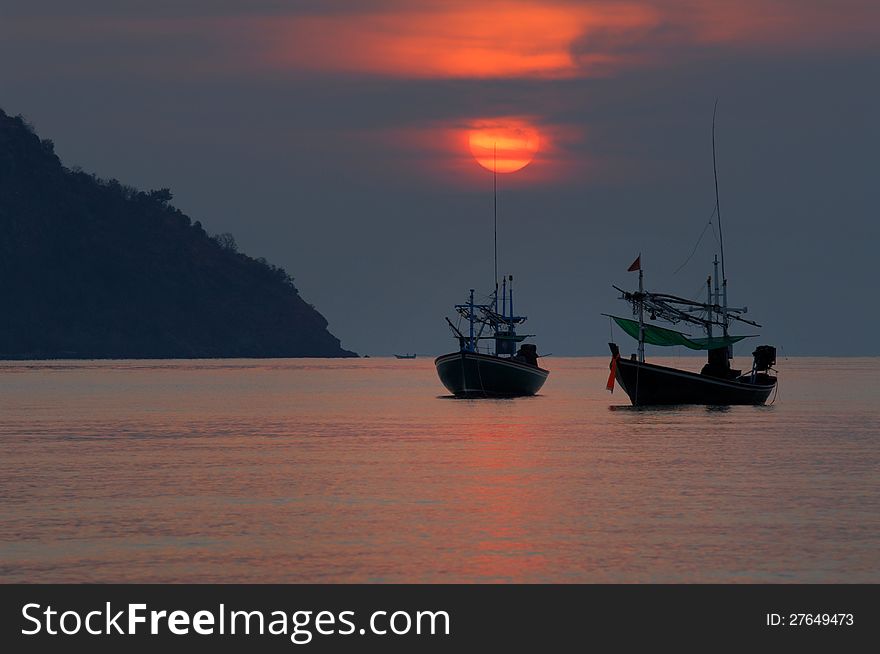 Fishing boat on a sunset.Sam roi yod beach Prachuap Khiri Khan Province.Thailand