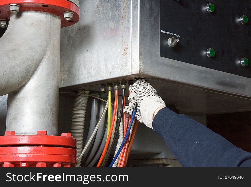 Repairman at work for a maintenance job in a site