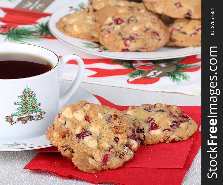 Two cranberry cookies on a napkin with cup of coffee. Two cranberry cookies on a napkin with cup of coffee