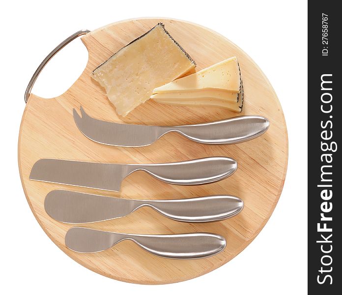 Slices of old cheese on cutting board with set of knives. Slices of old cheese on cutting board with set of knives.