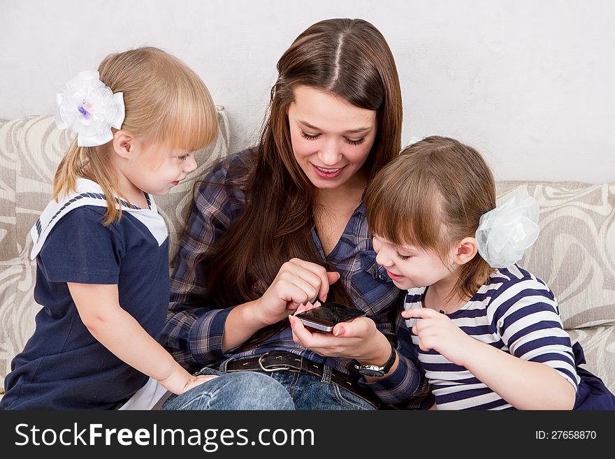 The three sisters with smartphones