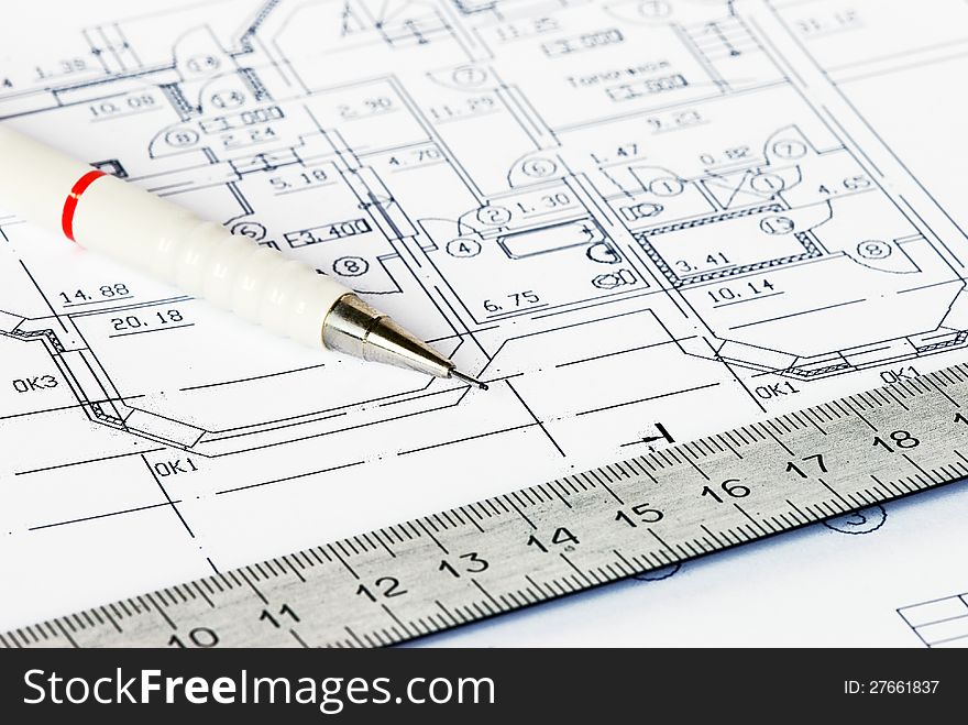 The drawing of house with a pencil and a ruler close-up