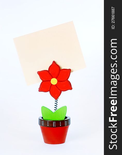 Pure colored card in business card holder in the form of a flower on a white background