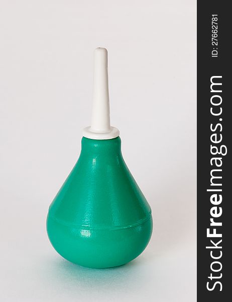 Green Syringe On White