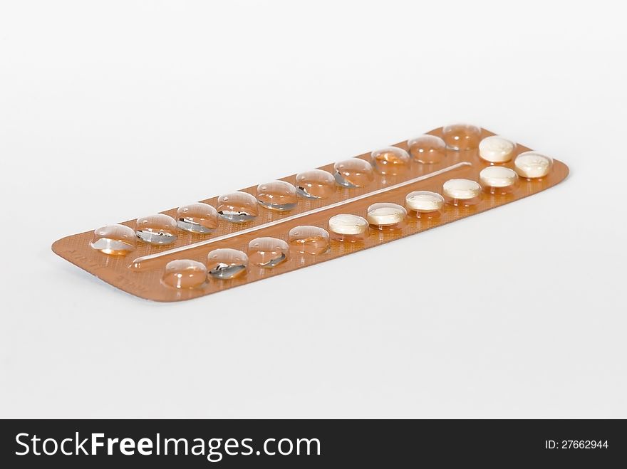 Birth control pills on white