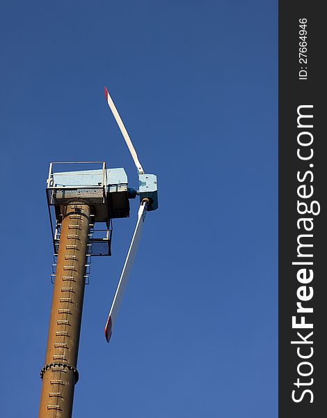 Modern windmill against blue sky