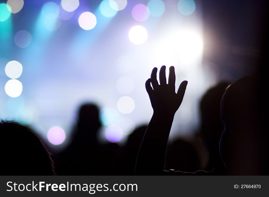 Crowd at concert and stage lights