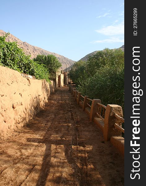 Mud constructed town in the Taklamakan desert in an oasis, Xinjiang, western China. The site was along the ancient northern silk road. Mud constructed town in the Taklamakan desert in an oasis, Xinjiang, western China. The site was along the ancient northern silk road