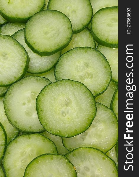 Cut green cucumber texture close up full frame