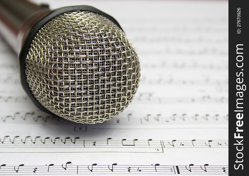 Detail metal microphone with musical notes