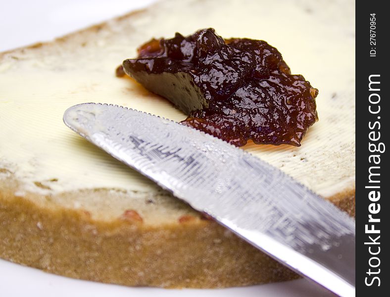 Closeup of bread with butter and strawberry jam. Closeup of bread with butter and strawberry jam