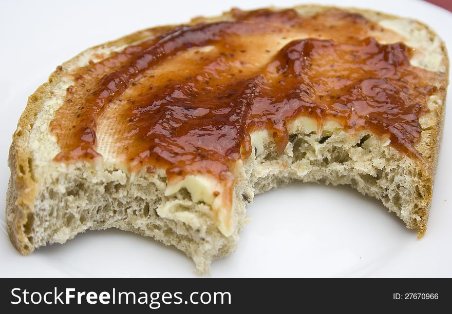 Delicious slice of bread with butter and strawberry jam. Delicious slice of bread with butter and strawberry jam