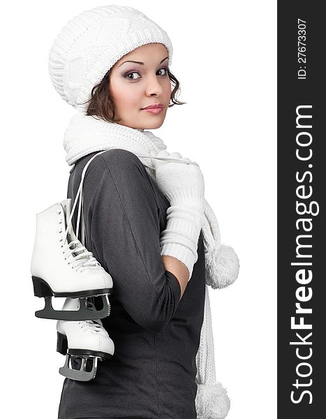 Pretty girl with figure skates on her shoulders