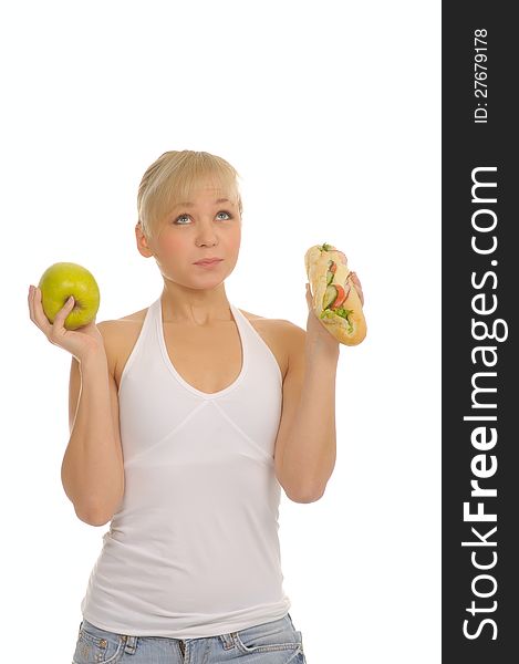 Slim Woman Choosing Between Apple And Hamburger