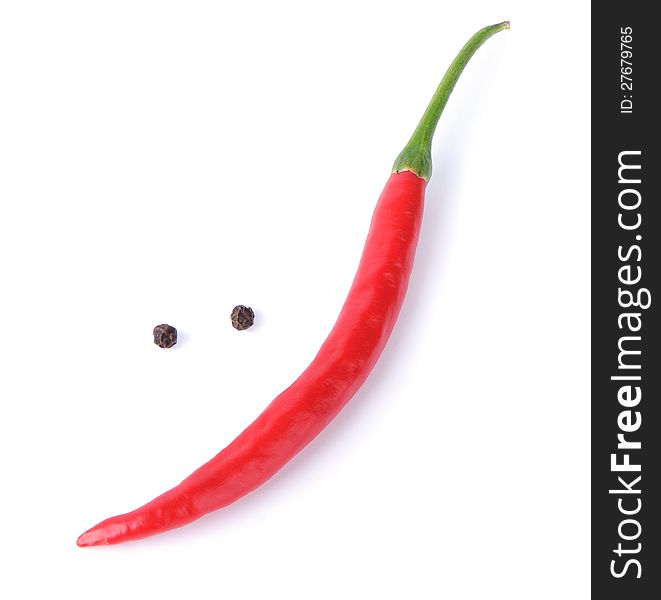 Red chili pepper forming a funny face with  smile on a white