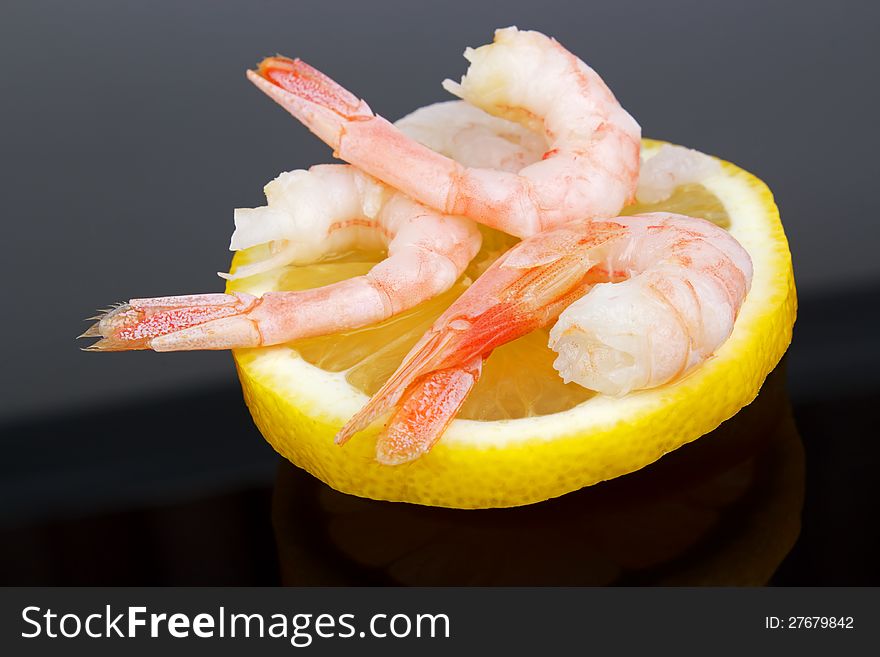 Fresh shrimps with lemon, dark background. Fresh shrimps with lemon, dark background