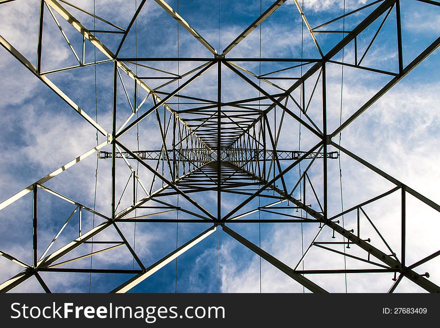 Power pole under cloudy sky