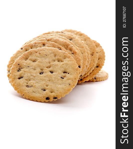 Dry Biscuits with Seeds in a Row closeup on white background