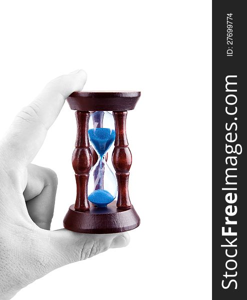 Hourglass in hand and time is non-stop. White background. Hourglass in hand and time is non-stop. White background