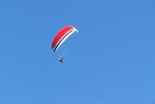 Red Paraplan In The Skies. Stock Photo