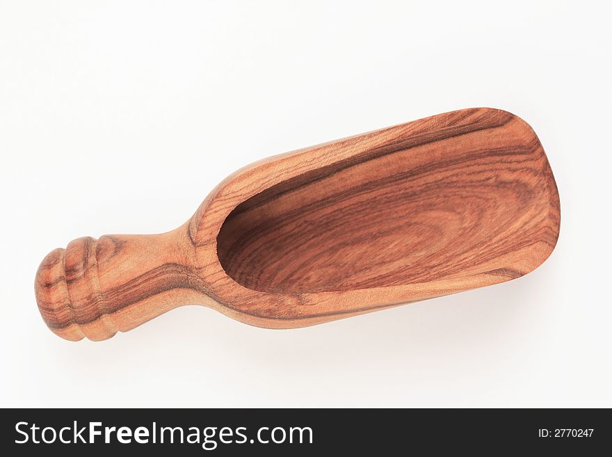 An empty small wooden shovel for use in the kitchen. An empty small wooden shovel for use in the kitchen