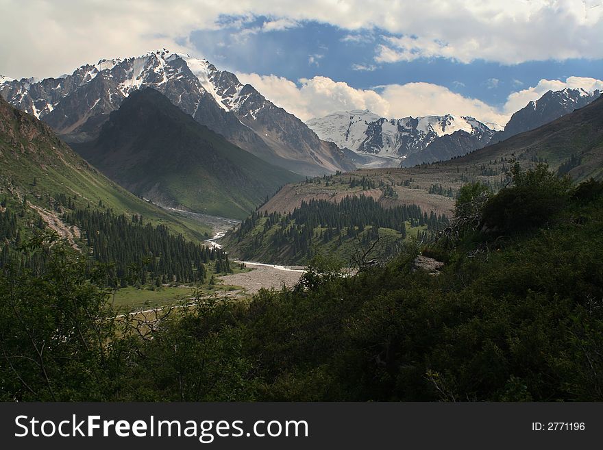 Green valley among white mountains. Green valley among white mountains