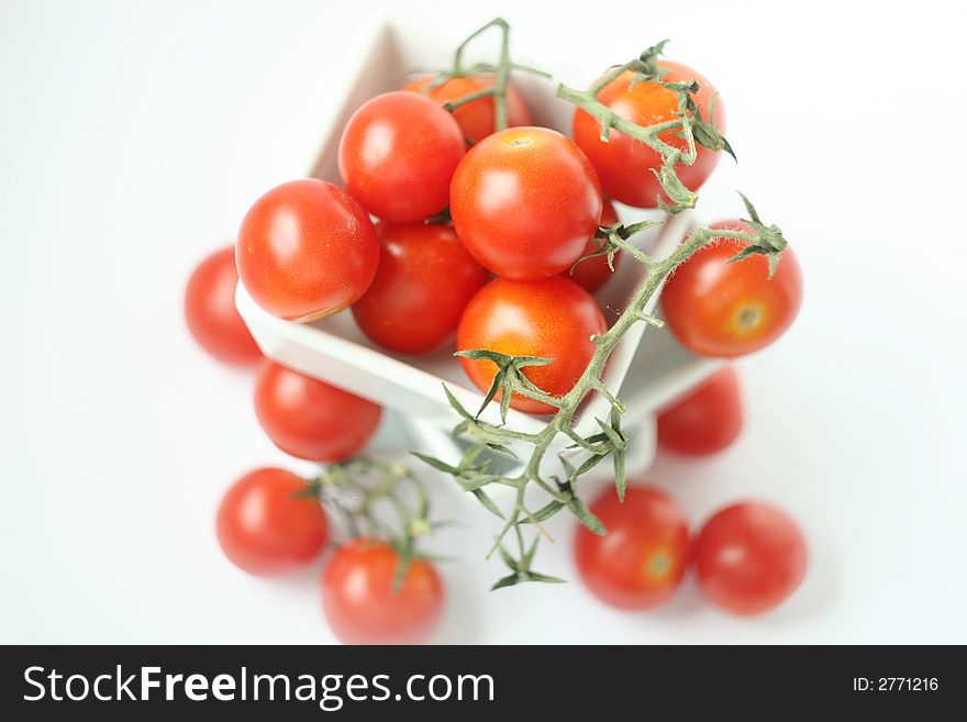 Fresh tomatoes in square bowl