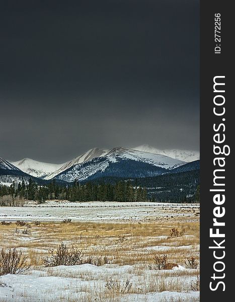 Winter mountains with snow and stormy gray sky in winter in Colorado. Winter mountains with snow and stormy gray sky in winter in Colorado