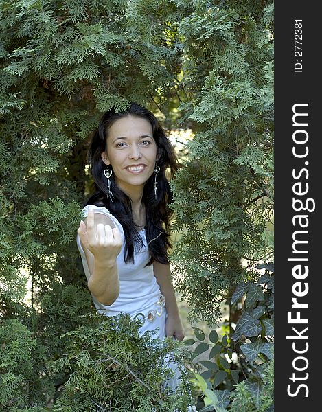 Young woman relaxing and exercising in the forest. Young woman relaxing and exercising in the forest