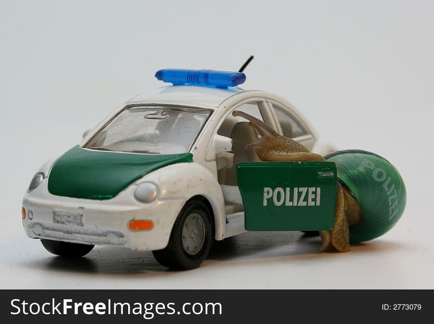 Policeman snail is getting into policecar