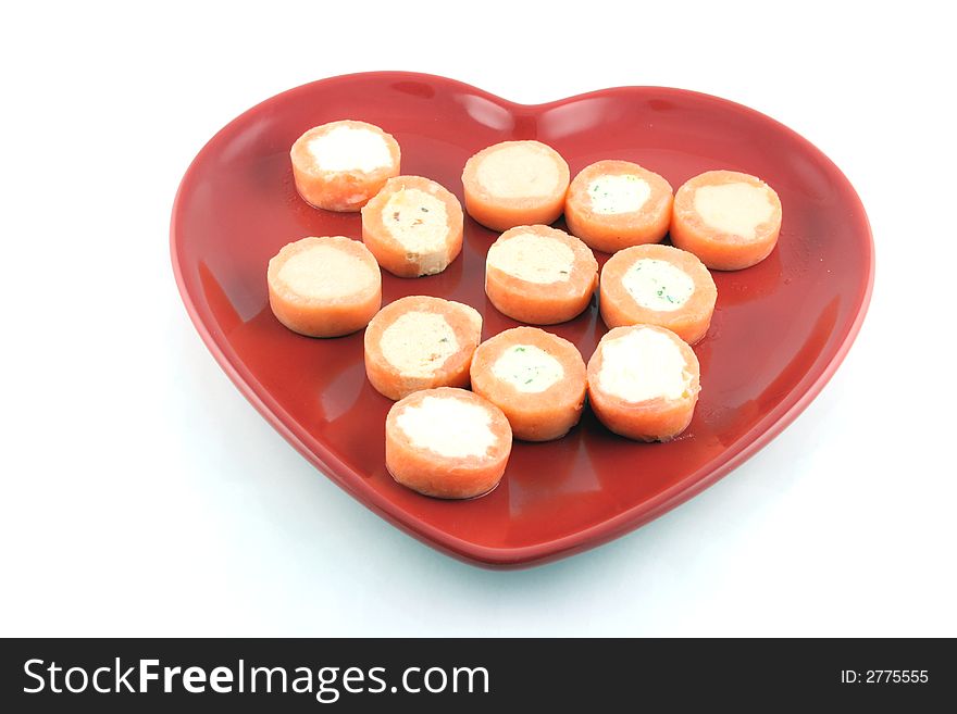 Entrees on a Heart Shaped Plate isolated on white. Entrees on a Heart Shaped Plate isolated on white