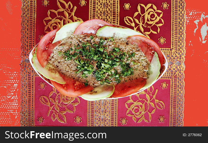 Dish of hummus with tomato and cucumber. Dish of hummus with tomato and cucumber