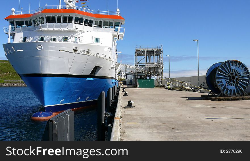 A look down the quayside from the restricted access end, ferry berthed, passenger gangway, industrial reel of SWR, a working pier.