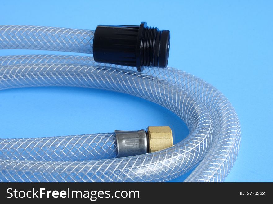 Plastic tube for water installation on blue background