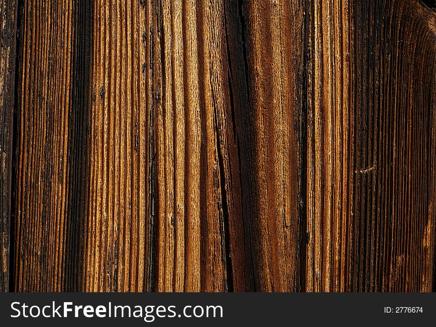 Wood detail - old rough, board background with clear wood grain. Wood detail - old rough, board background with clear wood grain.